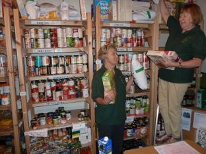 Denise and Maureen in the storeroom